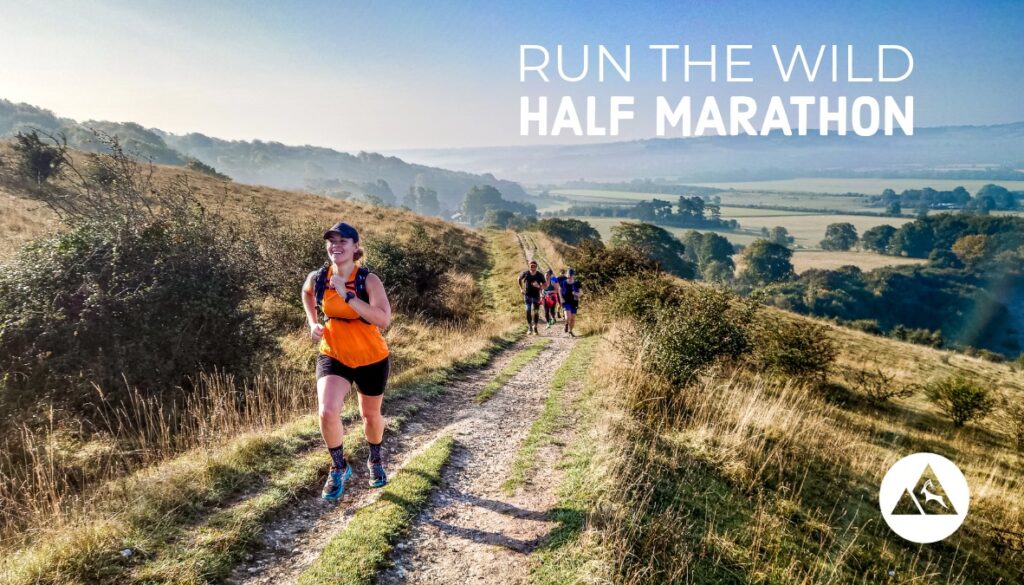 Trail runner running onto the Chiltern Hills on the Run the Wild Half Marathon