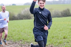 Trail runners running in the Chilterns on the Berko 10km organised by Run the Wild