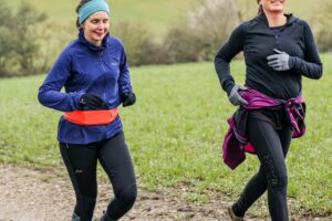 Trail runners running in the Chilterns on the Berko 10km organised by Run the Wild