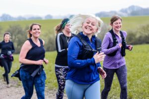 Trail runners running in the Chilterns on the Berko 10km organised by Run the Wild