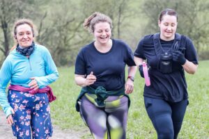 Trail runners running in the Chilterns on the Berko 10km organised by Run the Wild