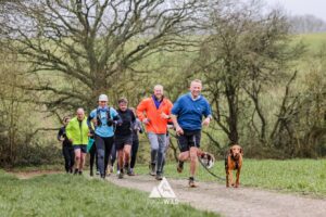 Trail runners running in the Chilterns on the Berko 10km organised by Run the Wild