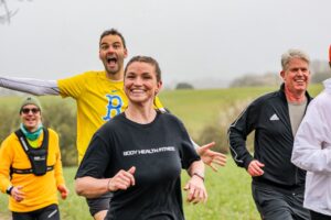 Trail runners running in the Chilterns on the Berko 10km organised by Run the Wild