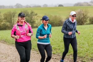 Trail runners running in the Chilterns on the Berko 10km organised by Run the Wild