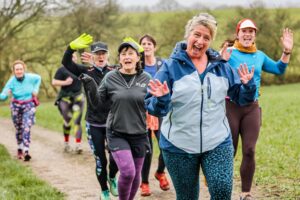 Trail runners running in the Chilterns on the Berko 10km organised by Run the Wild