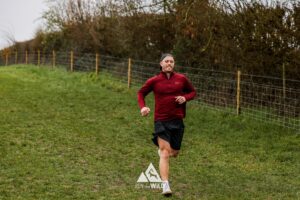 Trail runners running in the Chilterns on the Berko 10km organised by Run the Wild