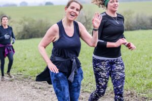 Trail runners running in the Chilterns on the Berko 10km organised by Run the Wild