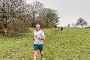 Trail runners running in the Chilterns on the Berko 10km organised by Run the Wild