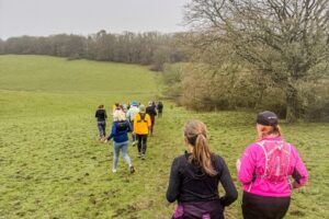 Trail runners running in the Chilterns on the Berko 10km organised by Run the Wild