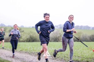 Trail runners running in the Chilterns on the Berko 10km organised by Run the Wild