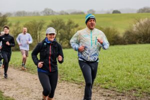 Trail runners running in the Chilterns on the Berko 10km organised by Run the Wild