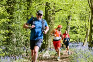 Runners completing the bluebell 10km in Tring with Run the Wild