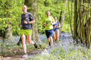 Runners completing the bluebell 10km in Tring with Run the Wild