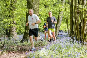 Runners completing the bluebell 10km in Tring with Run the Wild