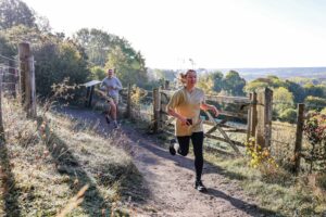 Trail runners completing the Water & Windmill 10 miler in the Chilterns with Run the Wild