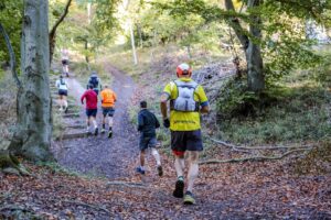 Trail runners completing the Water & Windmill 10 miler in the Chilterns with Run the Wild