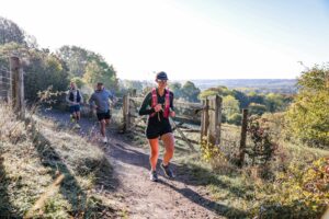 Trail runners completing the Water & Windmill 10 miler in the Chilterns with Run the Wild