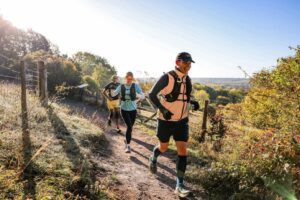 Trail runners completing the Water & Windmill 10 miler in the Chilterns with Run the Wild