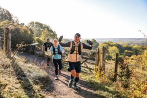 Trail runners completing the Water & Windmill 10 miler in the Chilterns with Run the Wild