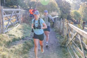Trail runners completing the Water & Windmill 10 miler in the Chilterns with Run the Wild