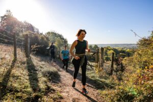 Trail runners completing the Water & Windmill 10 miler in the Chilterns with Run the Wild