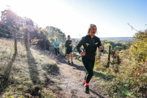 Trail runners completing the Water & Windmill 10 miler in the Chilterns with Run the Wild