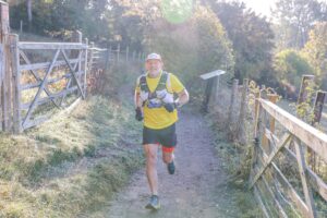 Trail runners completing the Water & Windmill 10 miler in the Chilterns with Run the Wild