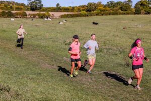 Trail runners completing the Water & Windmill 10 miler in the Chilterns with Run the Wild