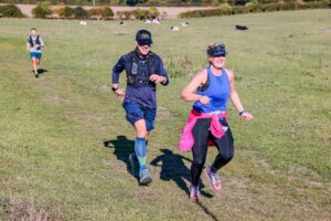 Trail runners completing the Water & Windmill 10 miler in the Chilterns with Run the Wild