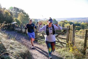 Trail runners completing the Water & Windmill 10 miler in the Chilterns with Run the Wild