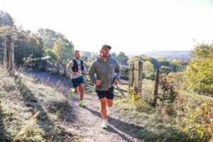 Trail runners completing the Water & Windmill 10 miler in the Chilterns with Run the Wild
