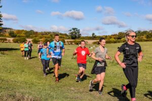Trail runners completing the Water & Windmill 10 miler in the Chilterns with Run the Wild