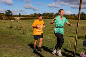 Trail runners completing the Water & Windmill 10 miler in the Chilterns with Run the Wild