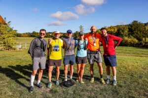Trail runners completing the Water & Windmill 10 miler in the Chilterns with Run the Wild