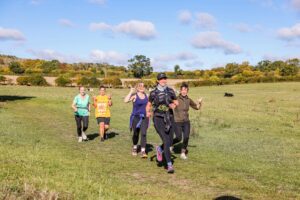 Trail runners completing the Water & Windmill 10 miler in the Chilterns with Run the Wild
